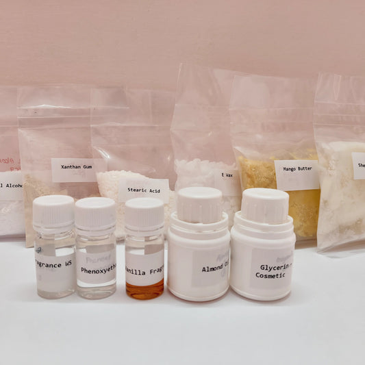 Assorted cosmetic ingredients including bottles and bags on a light pink background