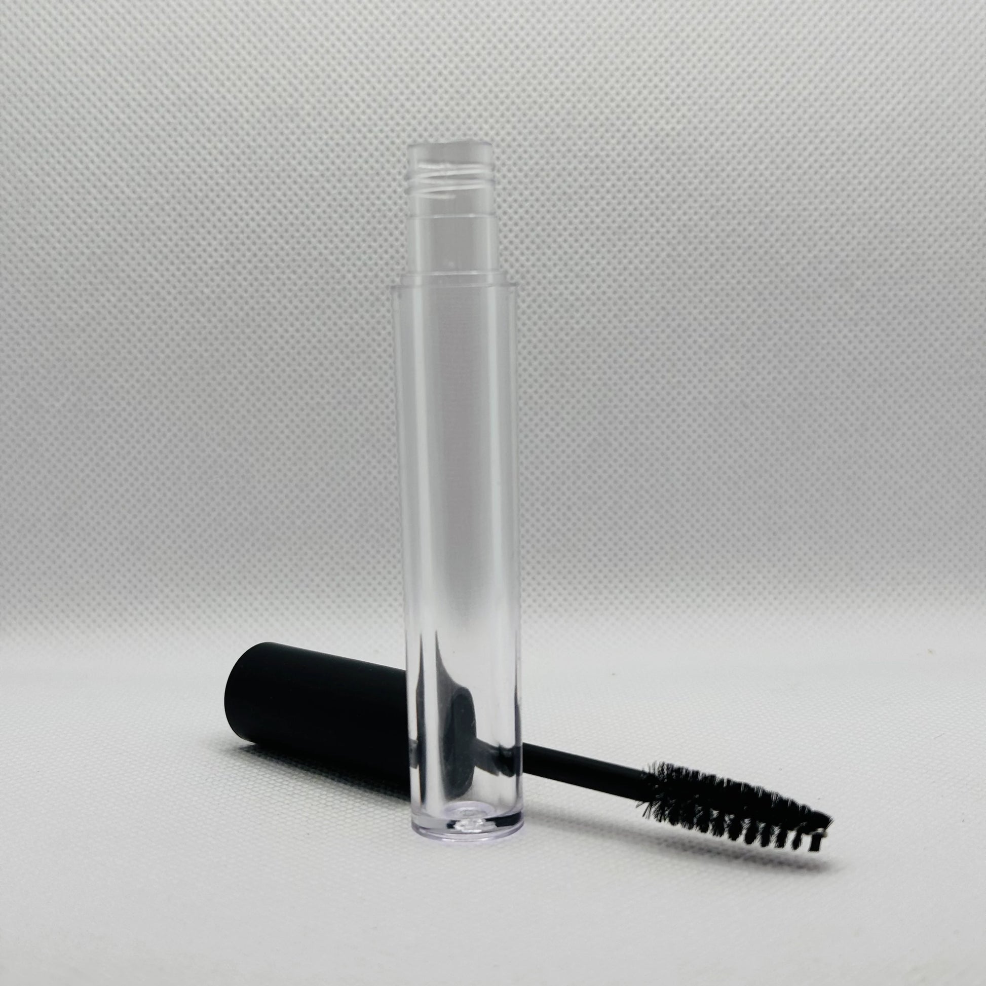 eyelash brush mascara container with white background