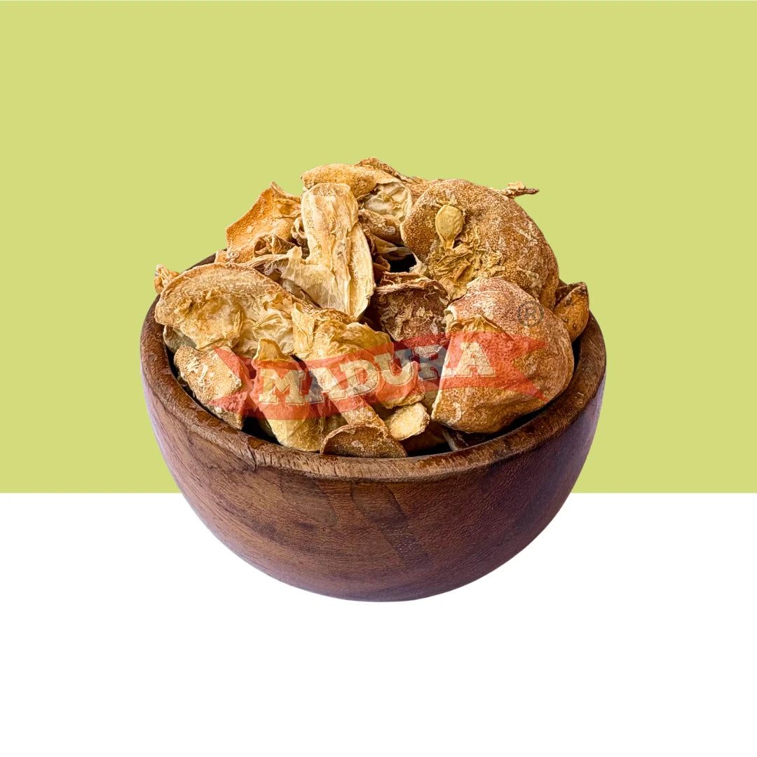 Wooden bowl filled with Lemon Peel Dried on a green background
