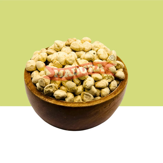 A wooden bowl filled with light beige dried MoringaSeedKernel, centered on a split green and white background with a red watermark across the middle.