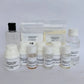A skincare shampoo kit with multiple small bottles, jars, and pouches of ingredients arranged on a white surface against a white background. The labels read 'SPRINKLE SOAP SHAMPOO KIT' and include items such as capsaicin, deryl glucoside, triglyceride, peppermint oil, and water.
