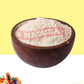 Wooden bowl filled with a Sweet Potato Powder.